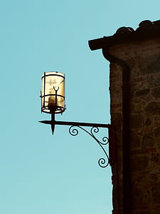 brown sconce under blue sky thumbnail