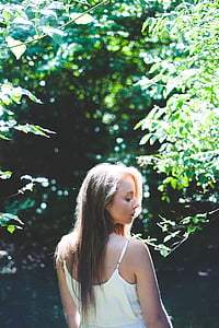 woman in the middle of trees thumbnail