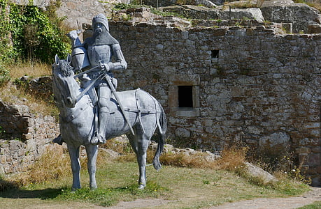 knight riding on horse statue near of concrete wall thumbnail