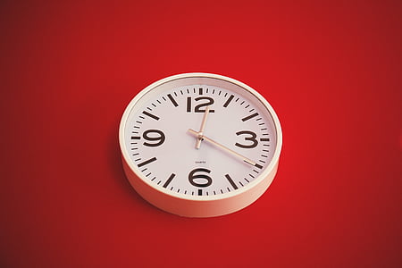 round white analog wall clock at 12:20 thumbnail