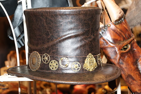 selective photography of brown and black leather hat thumbnail