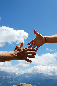 two hands reaching each other thumbnail