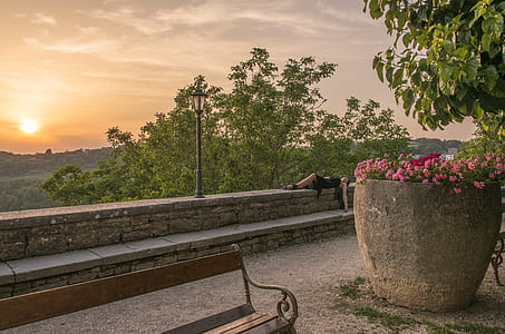 woman laying on grey concrete fence thumbnail