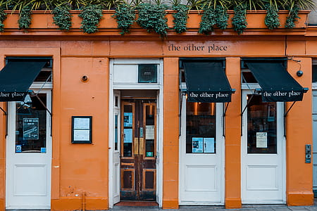 orange and white concrete building thumbnail