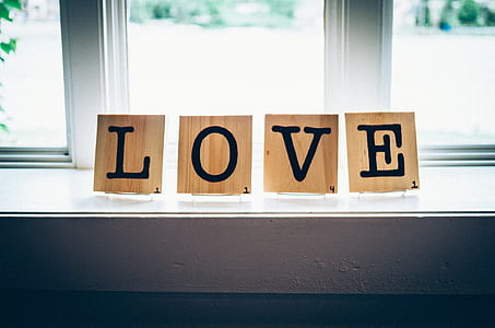 brown and black Love wooden freestanding letters on window thumbnail