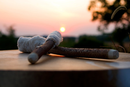 selective focus photo of brown and beige cross-shaped stick on brown wooden panel thumbnail