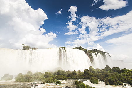 green trees across waterfalls thumbnail