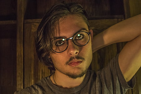 man wearing black eyeglasses and gray crew-neck T-shirt thumbnail