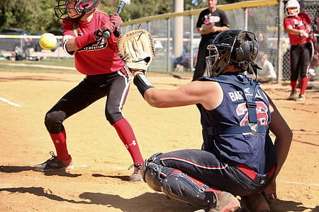two blue and red clothed baseball players on ball park thumbnail