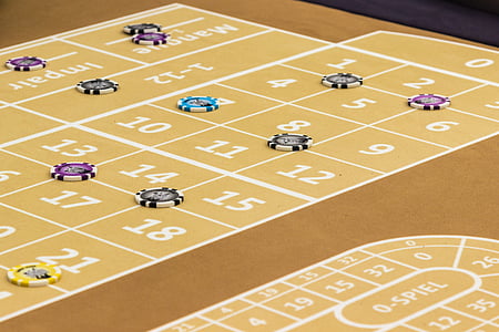 poker chips on table thumbnail