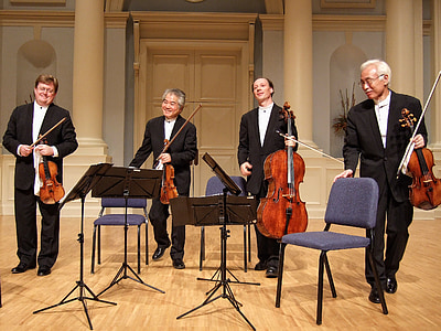 four men playing instruments thumbnail