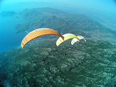 three assorted-color doing sky diving activity thumbnail
