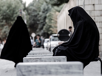 woman in black abayas outside during daytime thumbnail