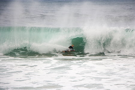 man on body of water with wave thumbnail