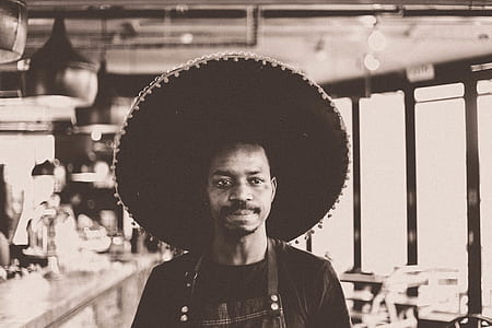 grayscale photo of man wearing sombrero thumbnail