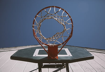 low-angle black and red portable hoop ring under gray sky during daytime thumbnail