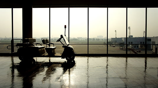 silhouette of golf cart inside airport thumbnail