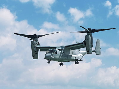 photo of silver helicopter on sky during daytime thumbnail