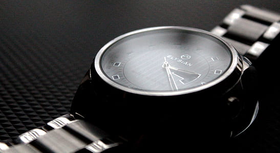 round wristwatch reading at 2:25 thumbnail
