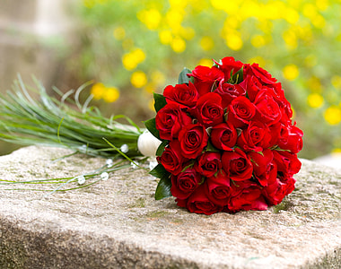 red roses bouquet on grey concrete surface thumbnail