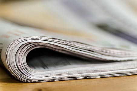 selective focus photo of newspaper thumbnail