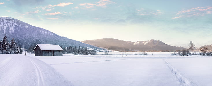 Snow Covered Landscape Against Mountain Range thumbnail