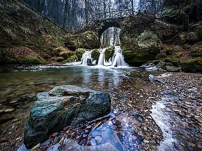 waterfalls surrounded with trees thumbnail
