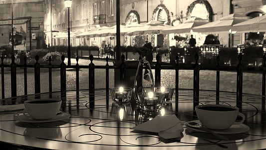 two teacups with chandelier on table thumbnail