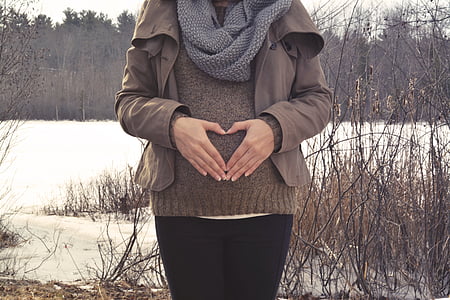 woman wearing brown zip-up jacket and grey knit infinity scarf thumbnail