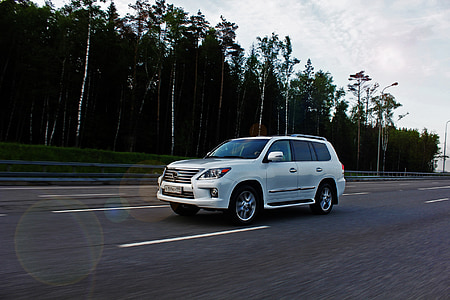white SUV on road thumbnail