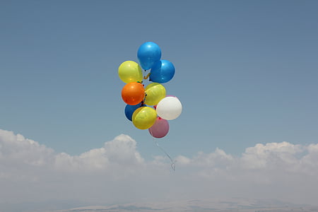 assorted color of balloons floating in clouds thumbnail