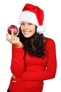 woman in red sweater holding red Christmas bauble thumbnail