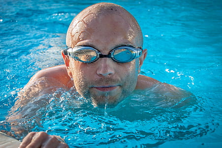 man with goggles in swimming pool thumbnail