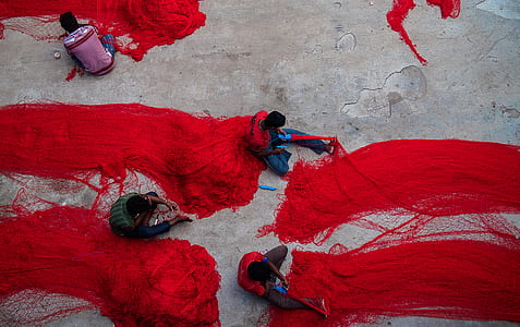 four men painting on street thumbnail