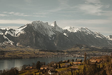 green mountains surrounded by trees thumbnail