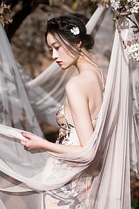 woman wearing grey and brown floral dress thumbnail
