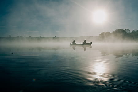 two person riding on a boat during daytime thumbnail