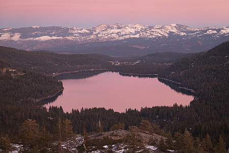 Aerial Photography of Lake Surrounded by Trees during Golden Hour thumbnail