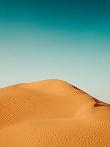 sand dune under blue sky thumbnail