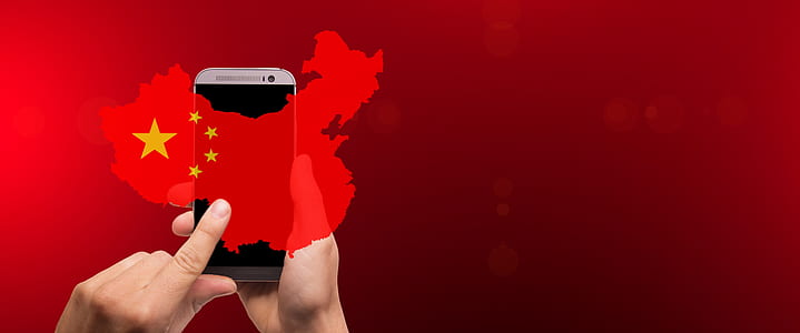 person touching smartphone displaying turkish flag thumbnail