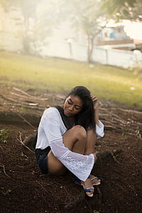 woman sitting under tree thumbnail