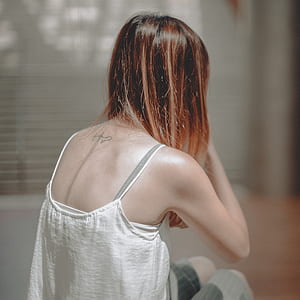 woman wearing white tank top thumbnail