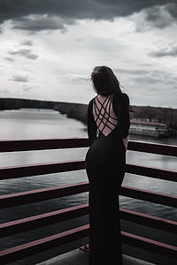woman wearing black and pink long-sleeved bodycon dress thumbnail