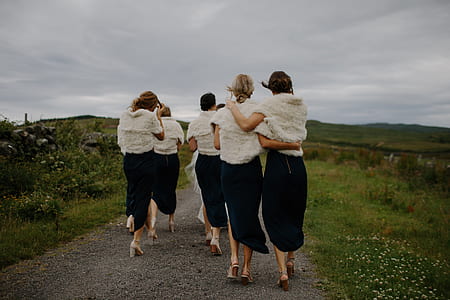 women walking on pathway thumbnail