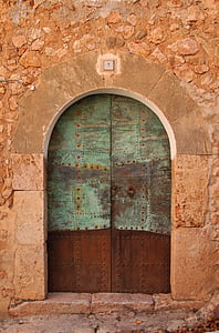 closed green and brown wooden door thumbnail