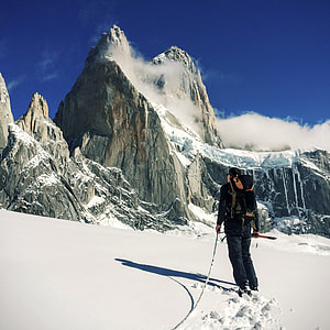 man climbing on the mountain covered snow thumbnail