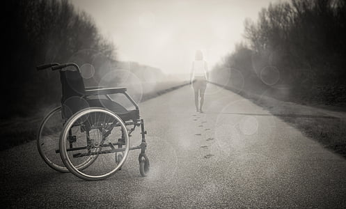 grayscale photo of wheelchair and faded woman thumbnail