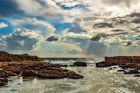rock formation with body of water thumbnail