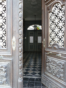 brown wooden 2-panel door near white and black lantern thumbnail