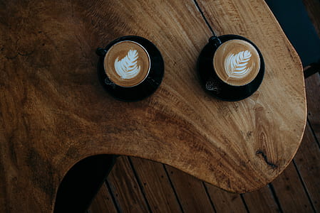 two cappuccino on table thumbnail